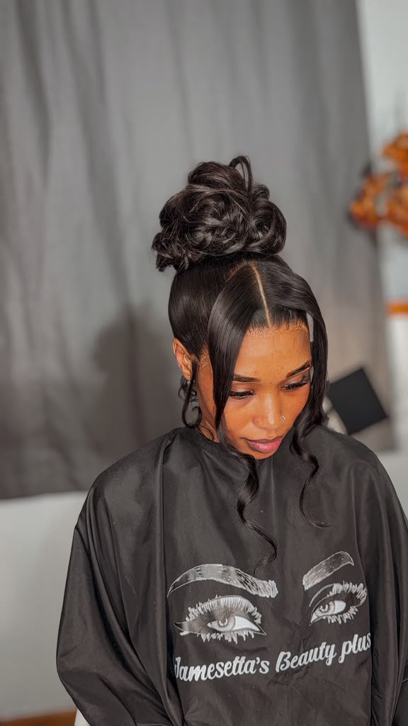 High Bun with Face-Framing Curls