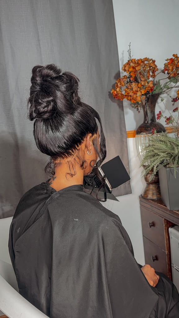 Textured High Bun with Cascading Curls